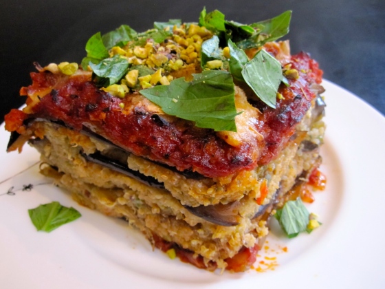Eggplant lasagne topped with pistachios and basil